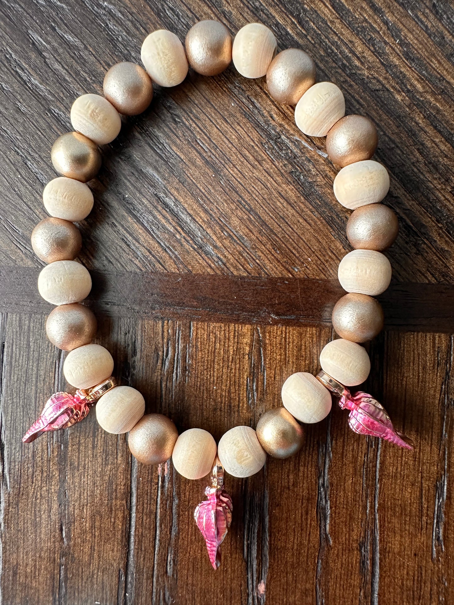 Hand Strung Beige, Gold Beaded Bracelet with Pink Sea Shell Accents